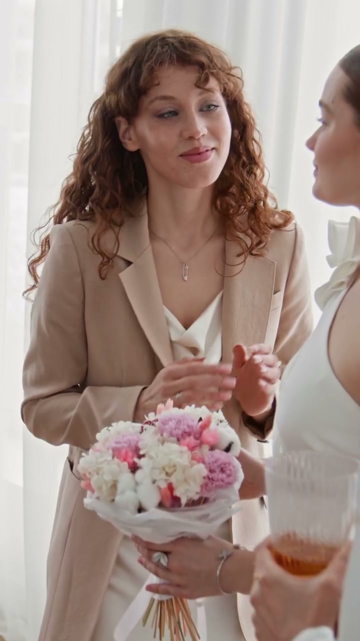 Bride Receives Bouquet from Friends
