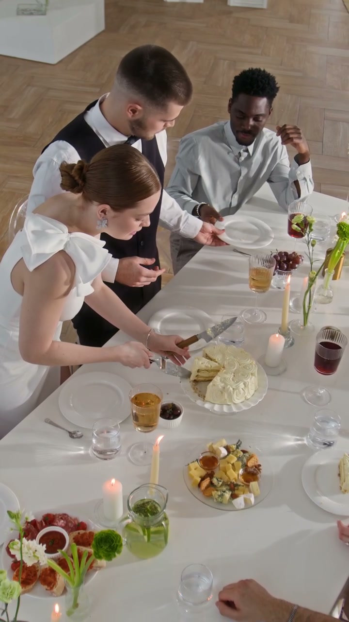 Wedding Couple Cuts Cake at Reception