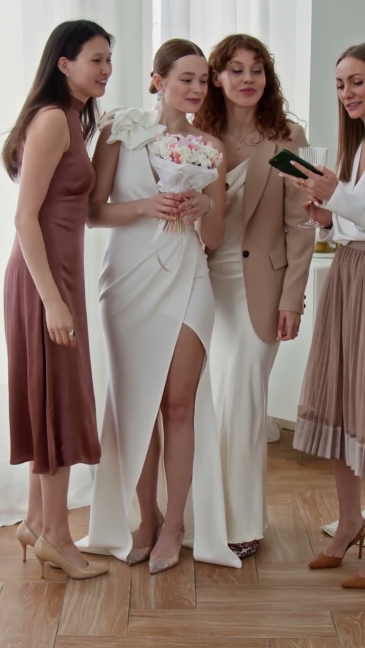 Bride and Friends Take Selfies on Wedding Day