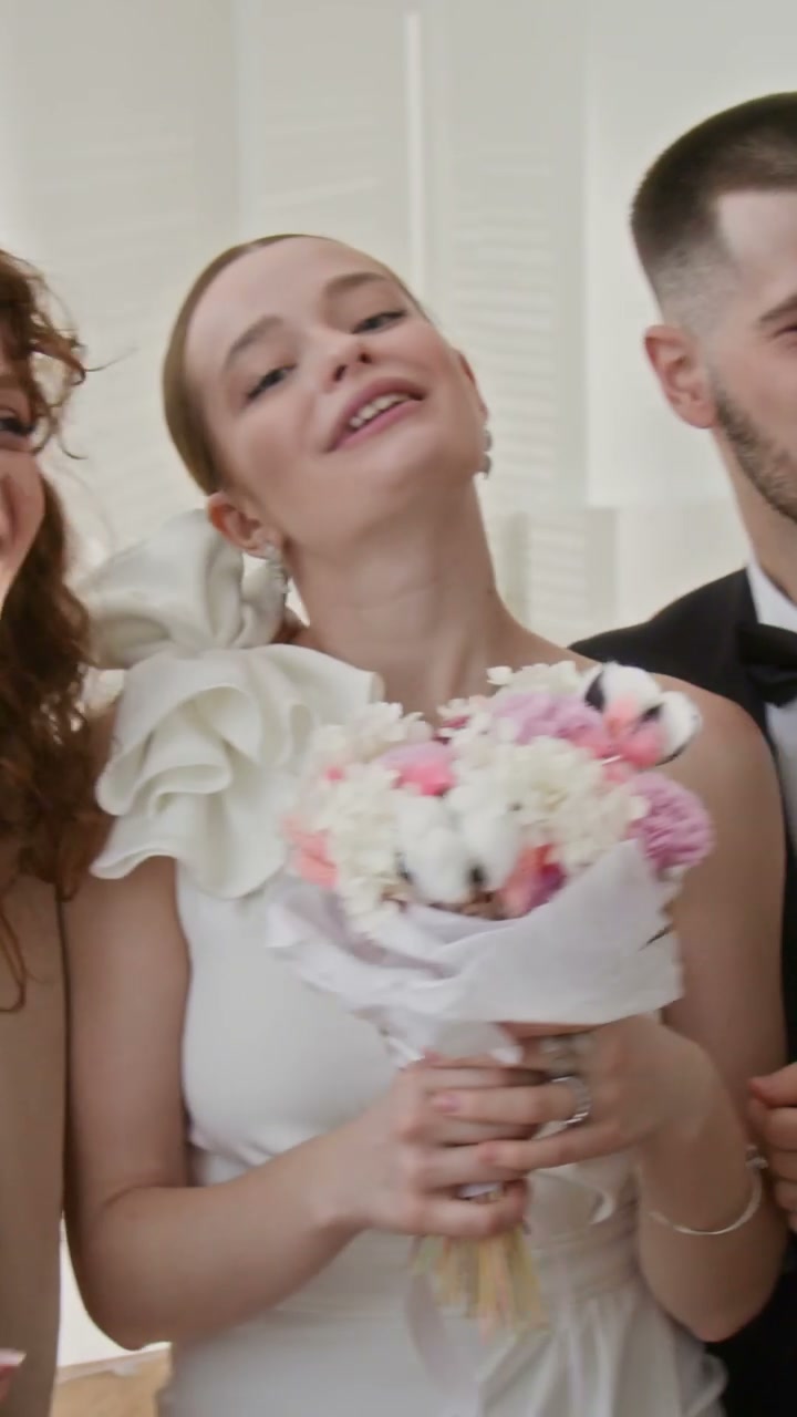 Happy Bride and Groom Showing Wedding Rings