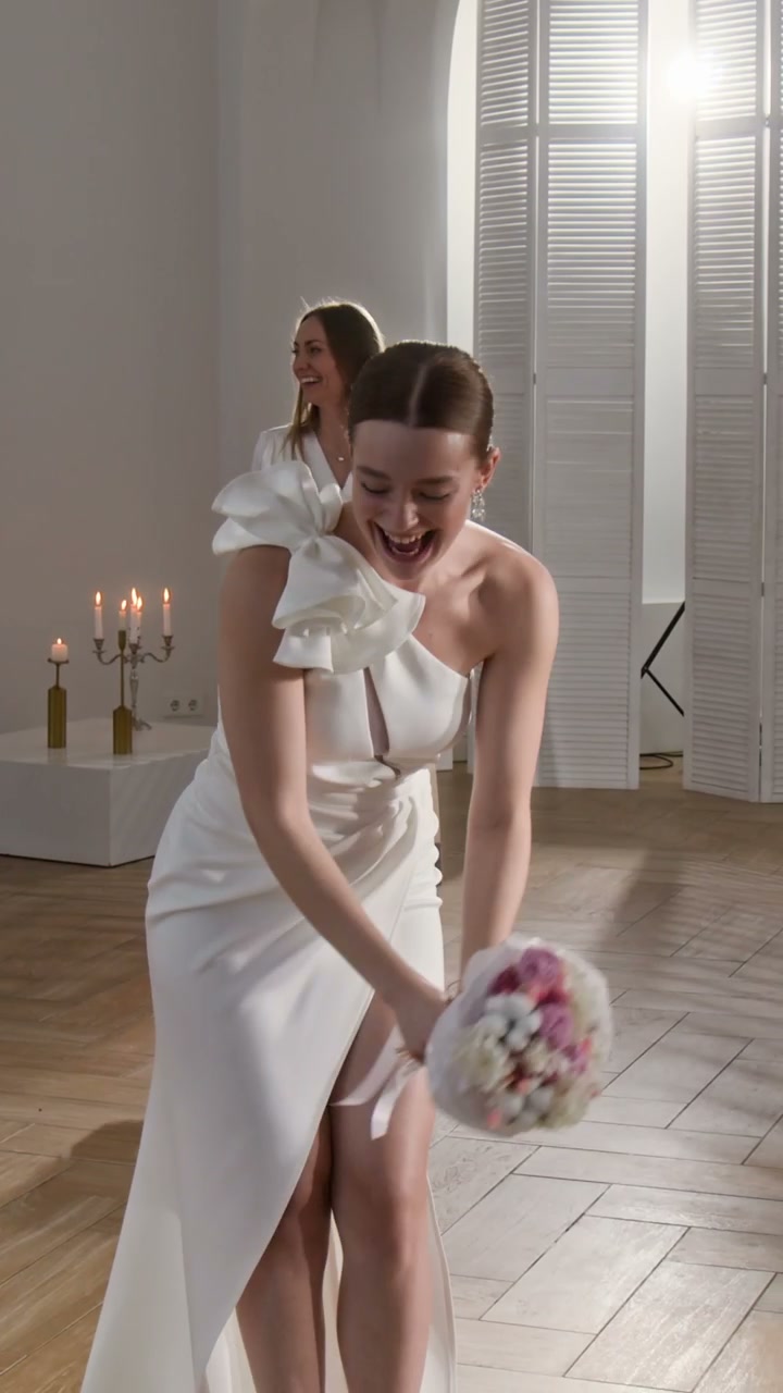 Joyful Bride Tosses Wedding Bouquet