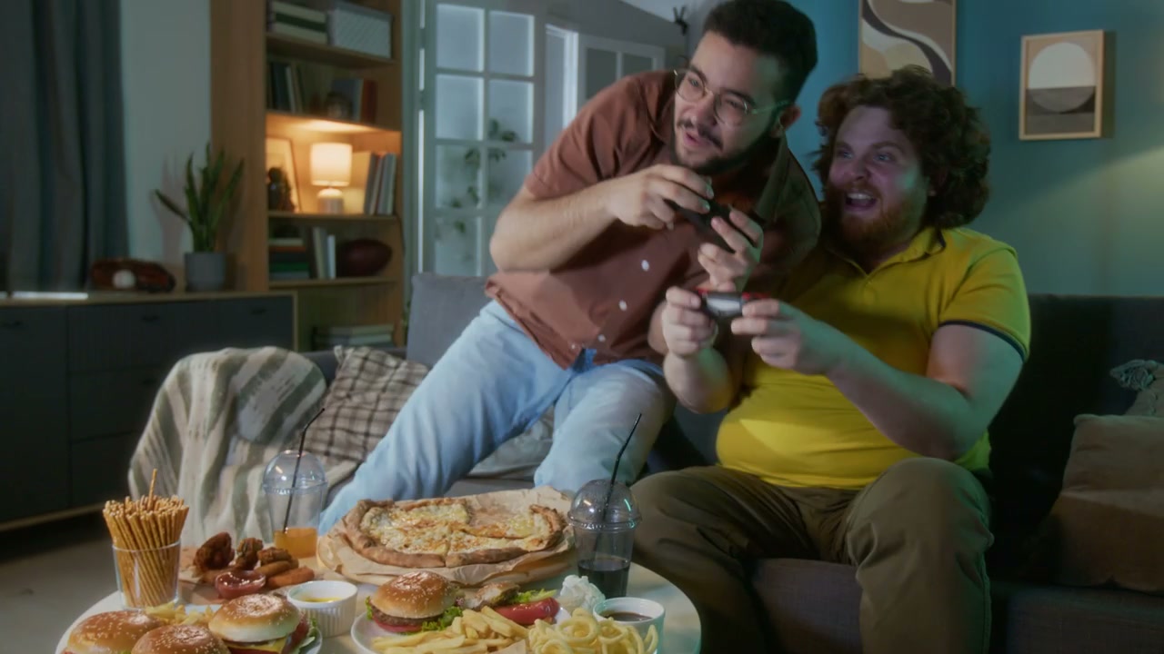 Friends Gaming and Eating Fast Food