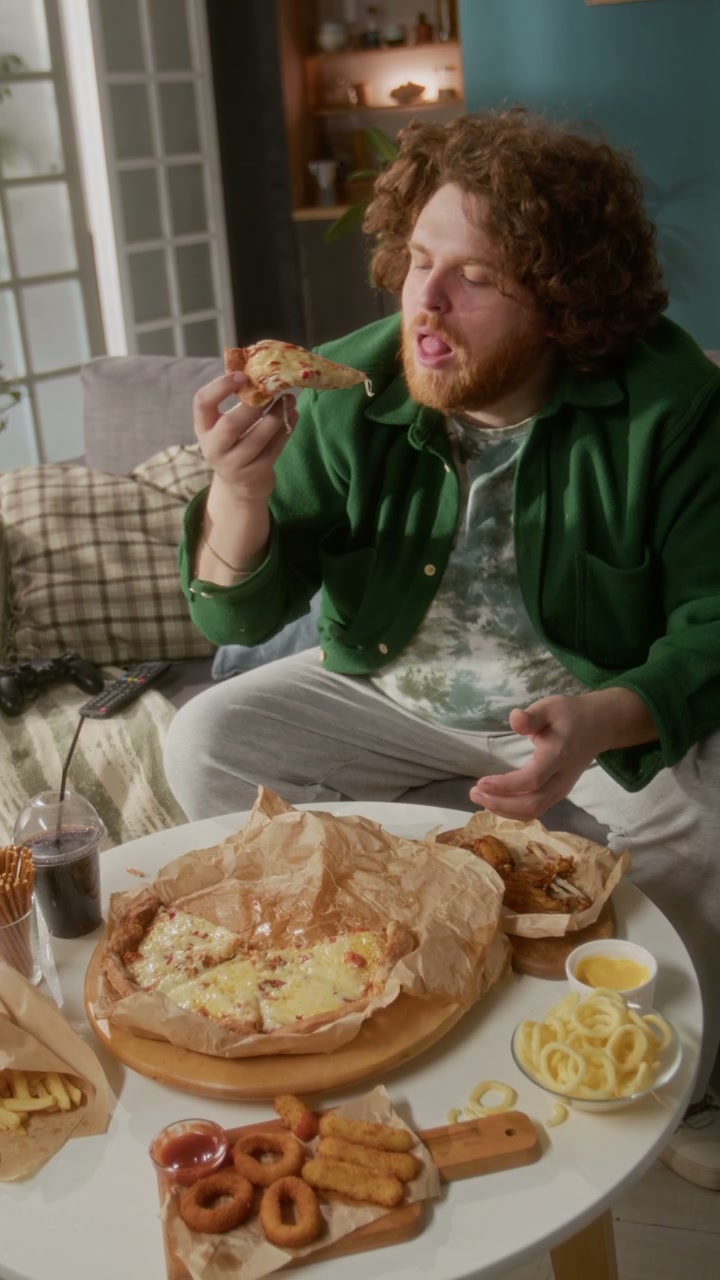 Man Enjoying Fast Food Feast At Home