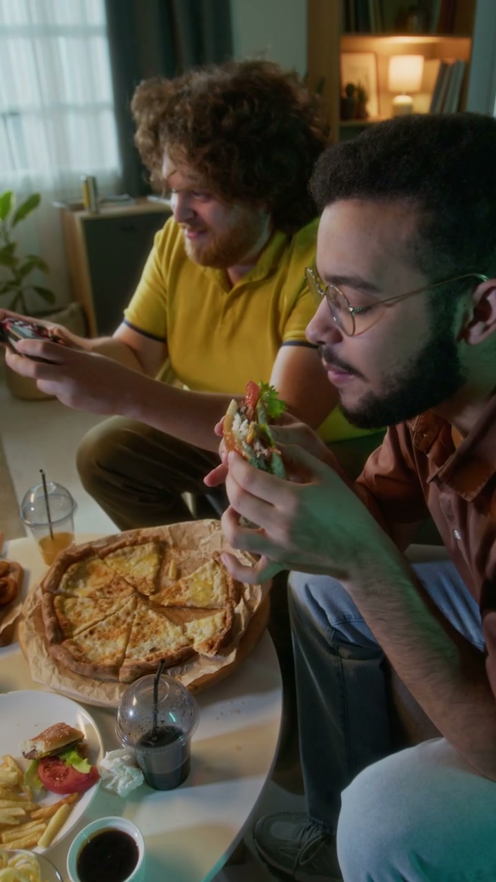 Men Playing Video Games and Eating Fast Food