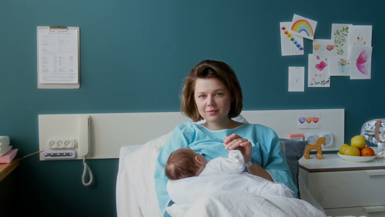 New Mother Breastfeeding Baby in Hospital