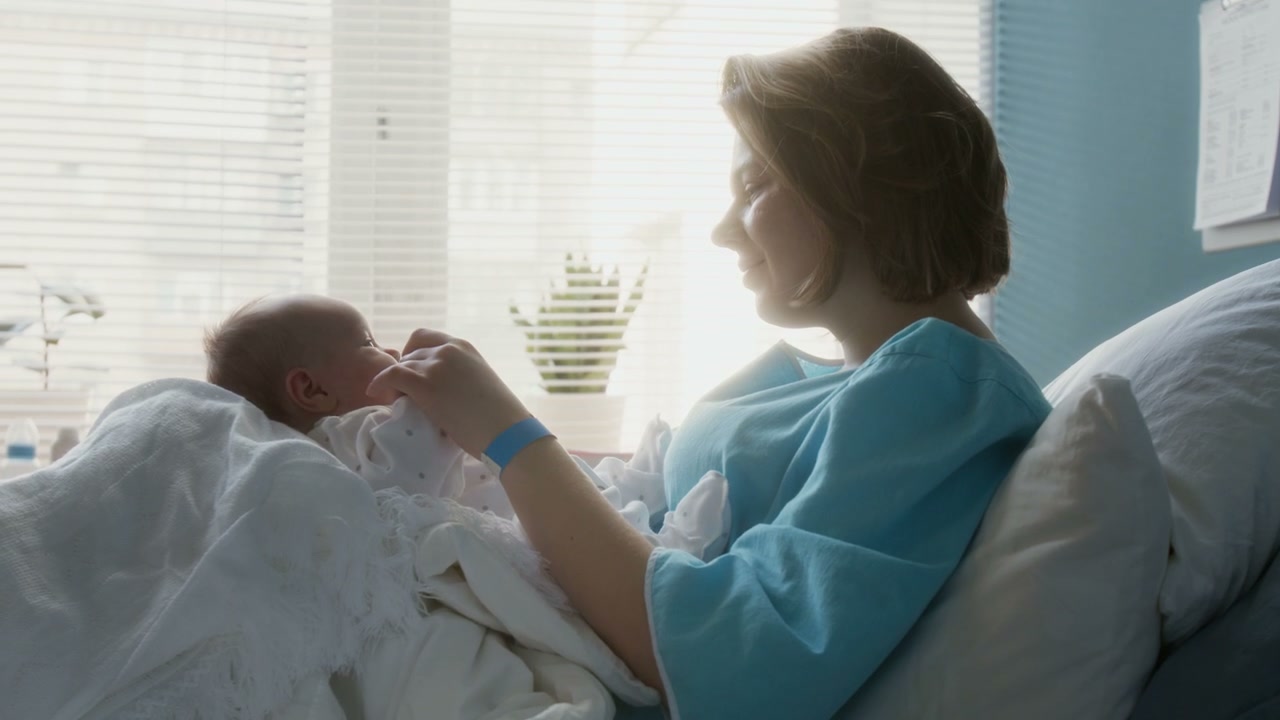 Mother Bonding with Newborn in Hospital