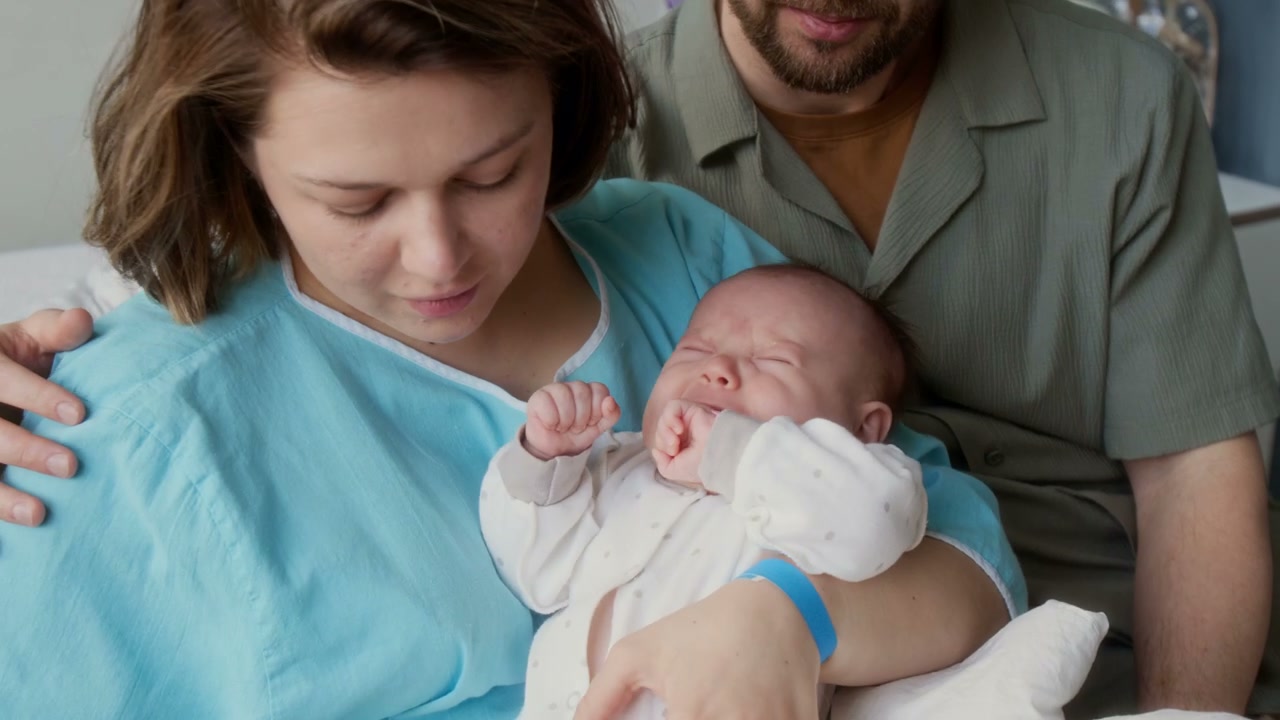 New Mother Holding Crying Newborn
