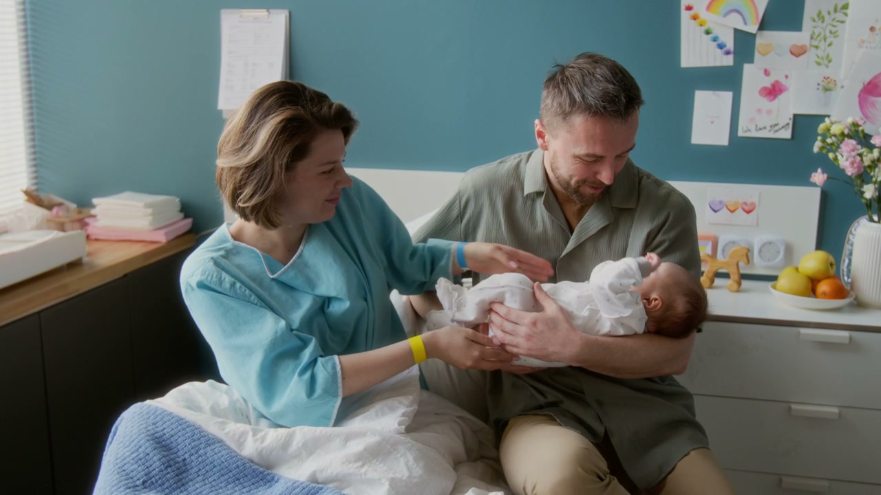 Parents Bonding with Newborn in Hospital