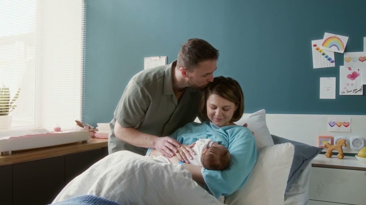 New Parents Bonding with Newborn in Hospital