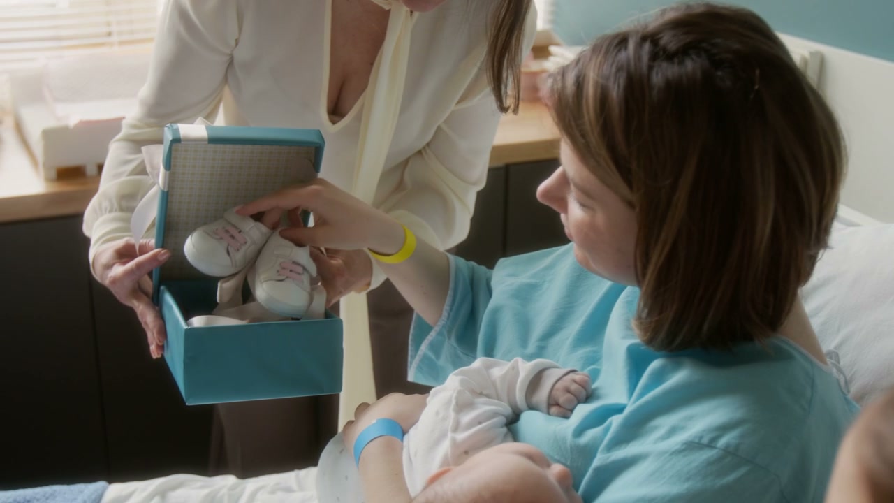 Mother Receives Baby Shoes in Hospital