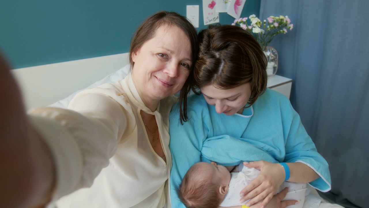 Family on Video Call with Newborn Baby