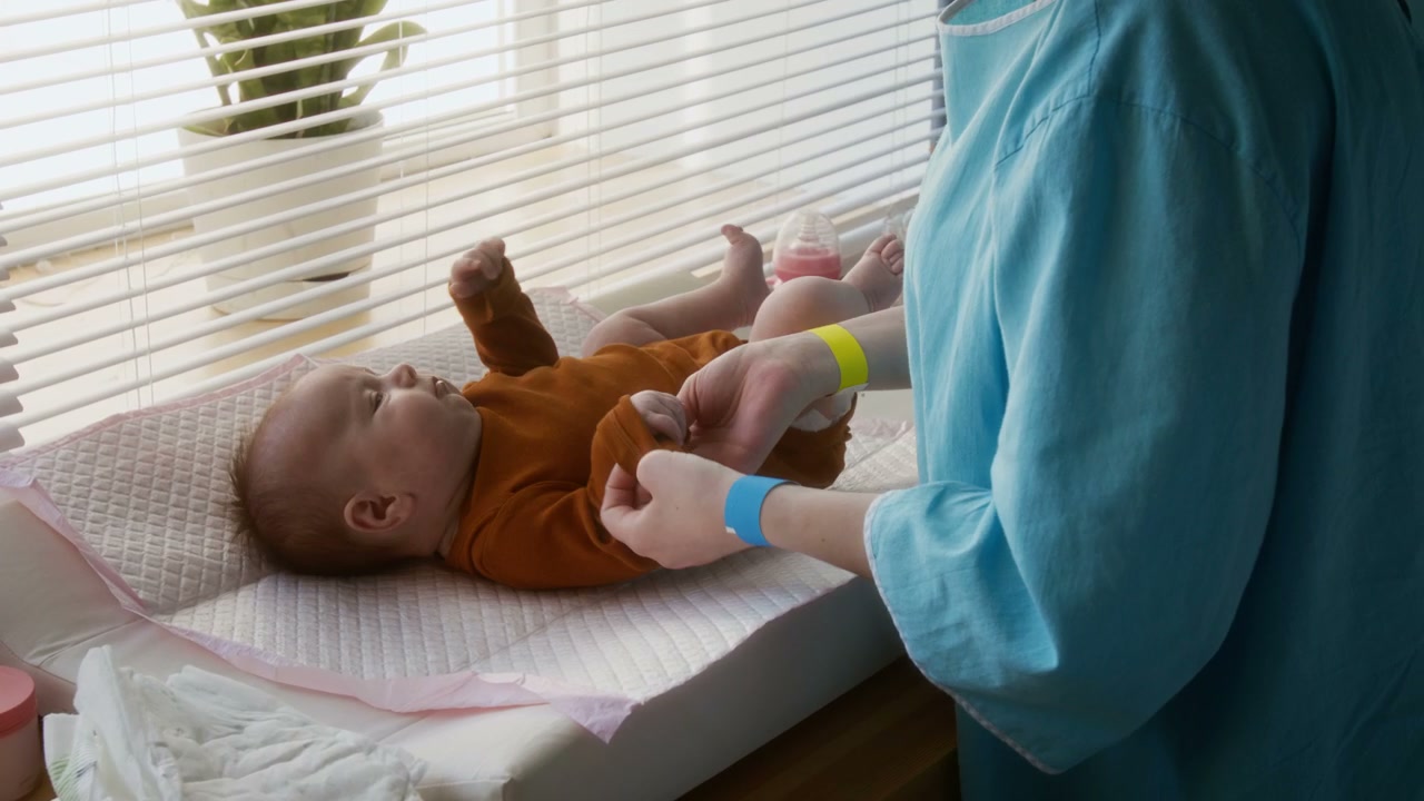 Mother Cares for Newborn Baby in Hospital