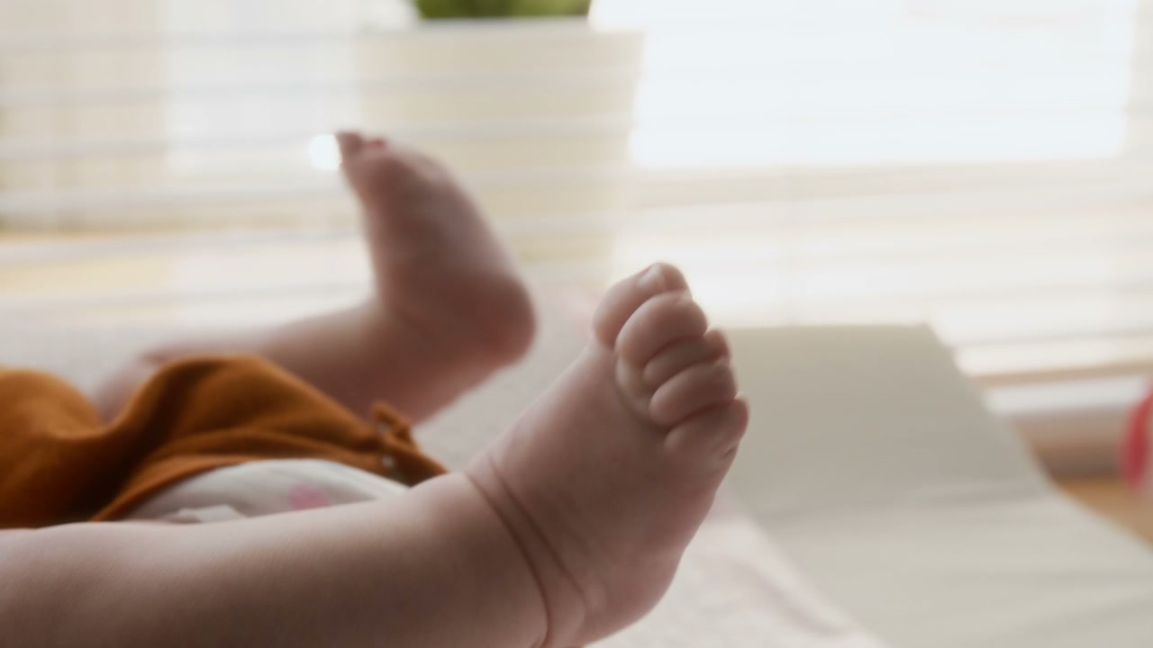 Newborn Baby's Feet Wiggling Close-Up