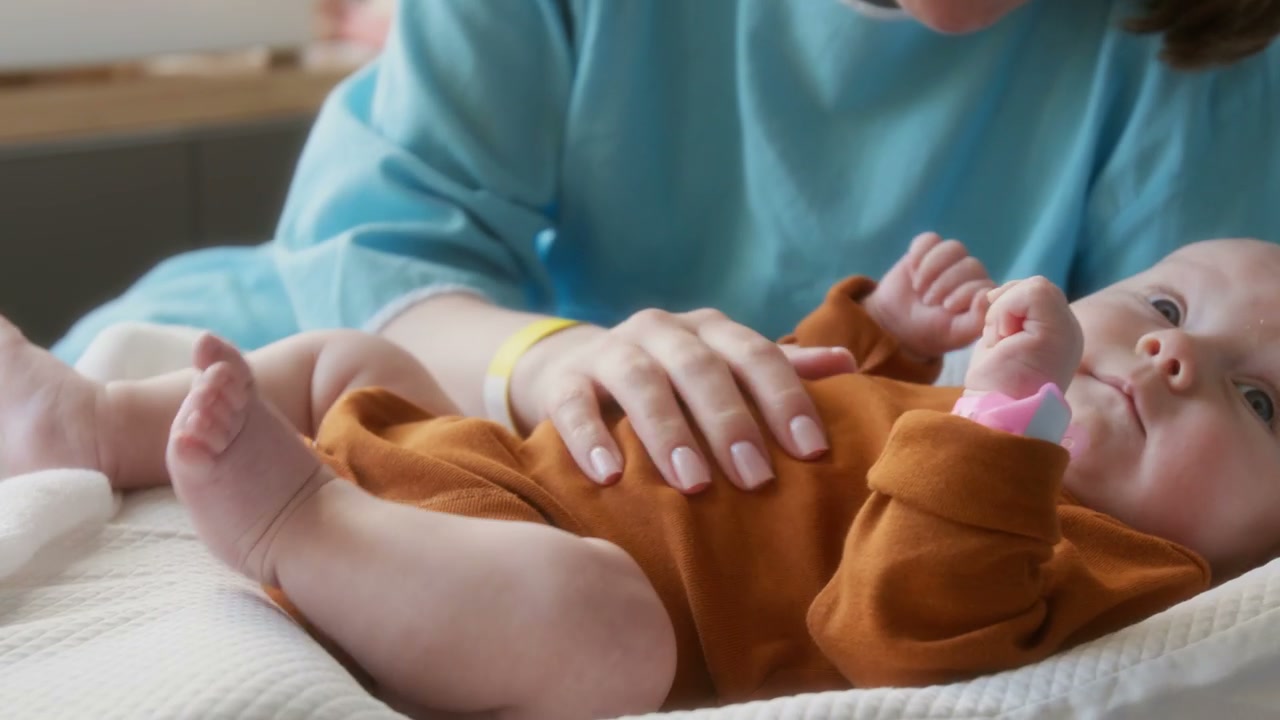 Mother Bonding with Newborn Baby in Hospital