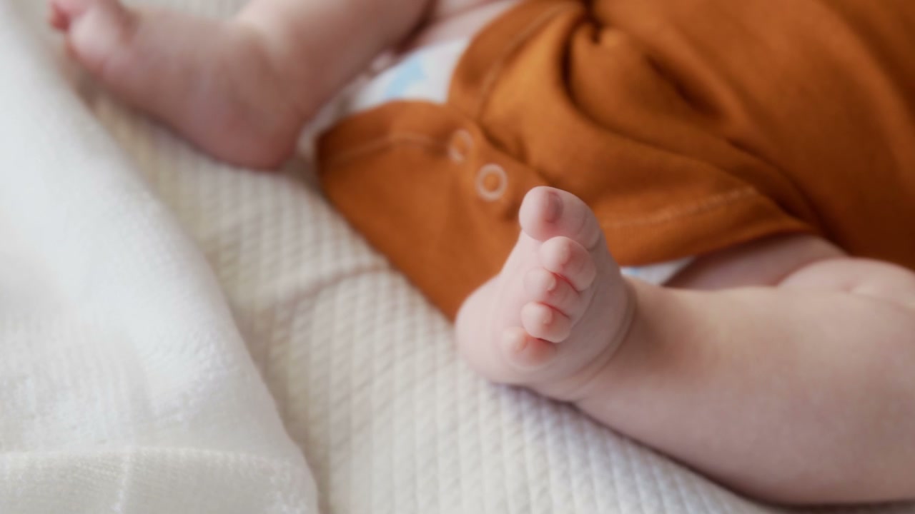 Newborn Baby's Feet Wiggling Close Up