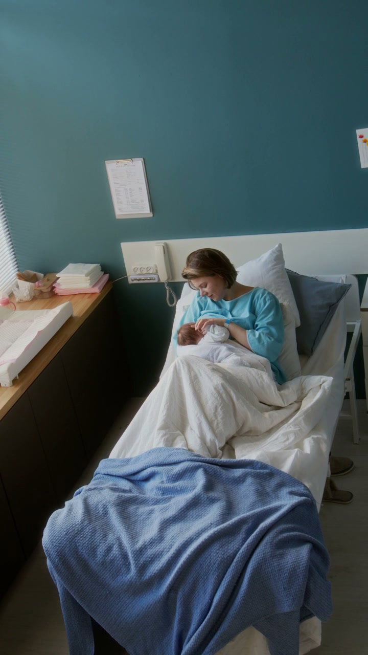 New Mother Bonding with Baby in Hospital