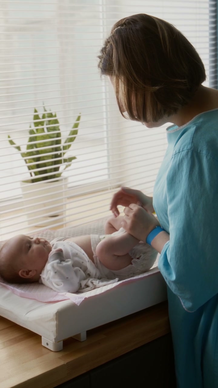 Mother Cares for Newborn Baby
