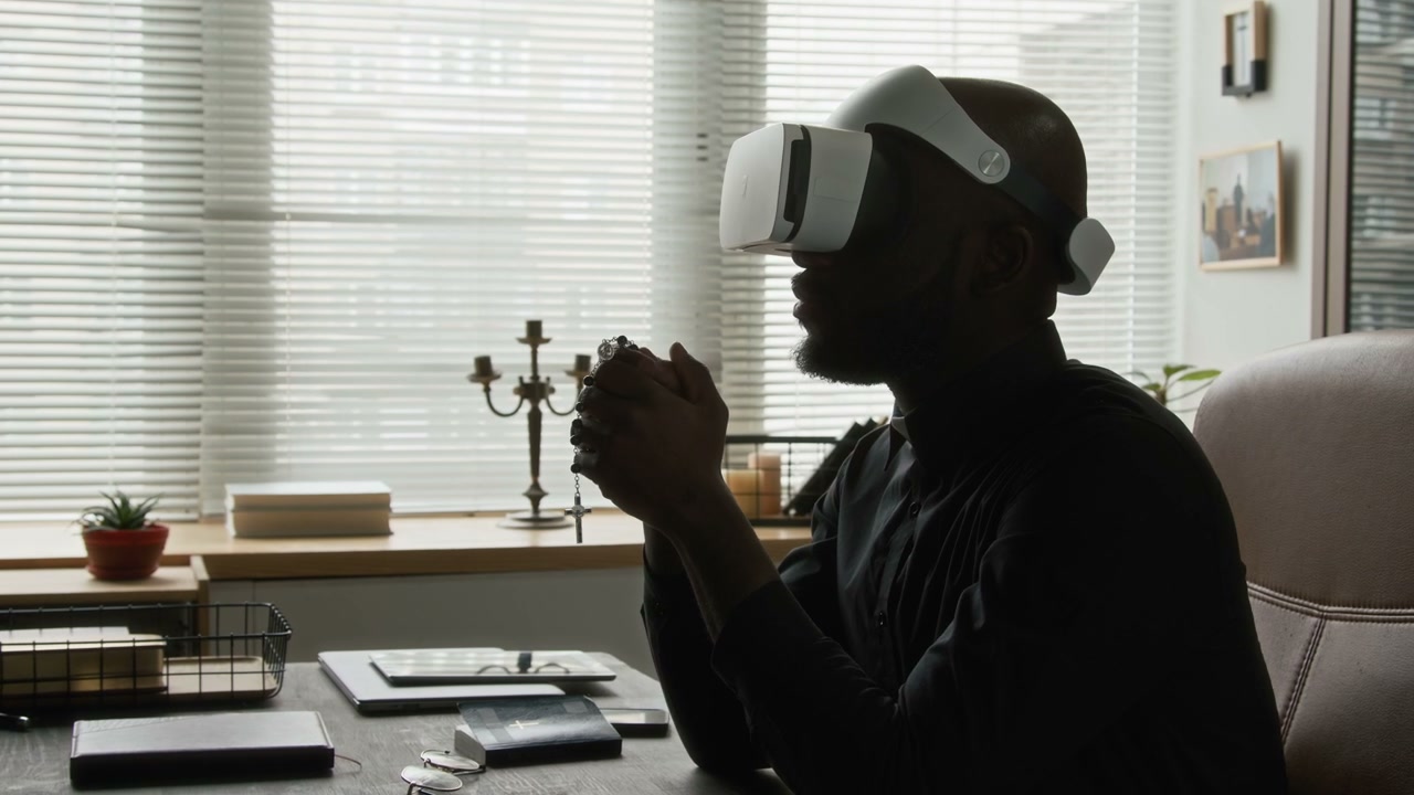 Clergyman Praying in Virtual Reality Headset