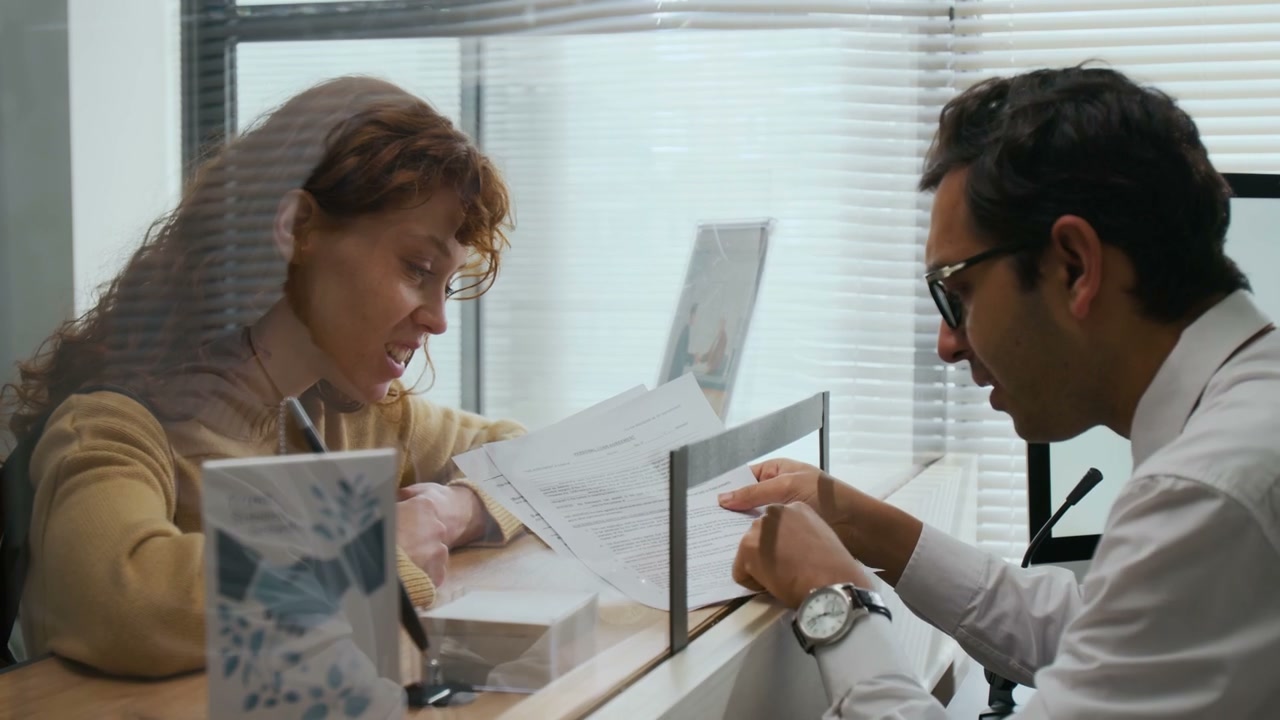Bank Teller Consulting with Client