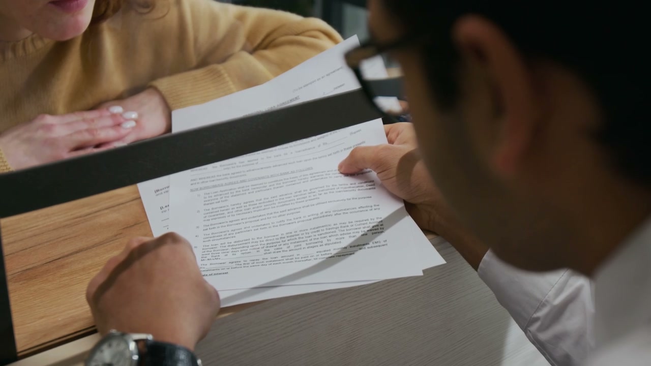 Financial Advisor Explains Document to Customer