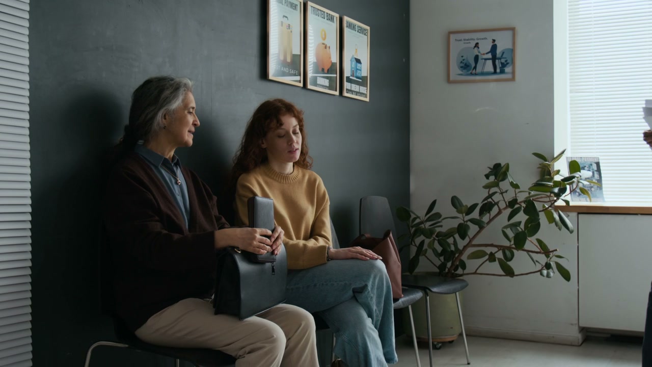 Two Women Waiting in a Bank Lobby