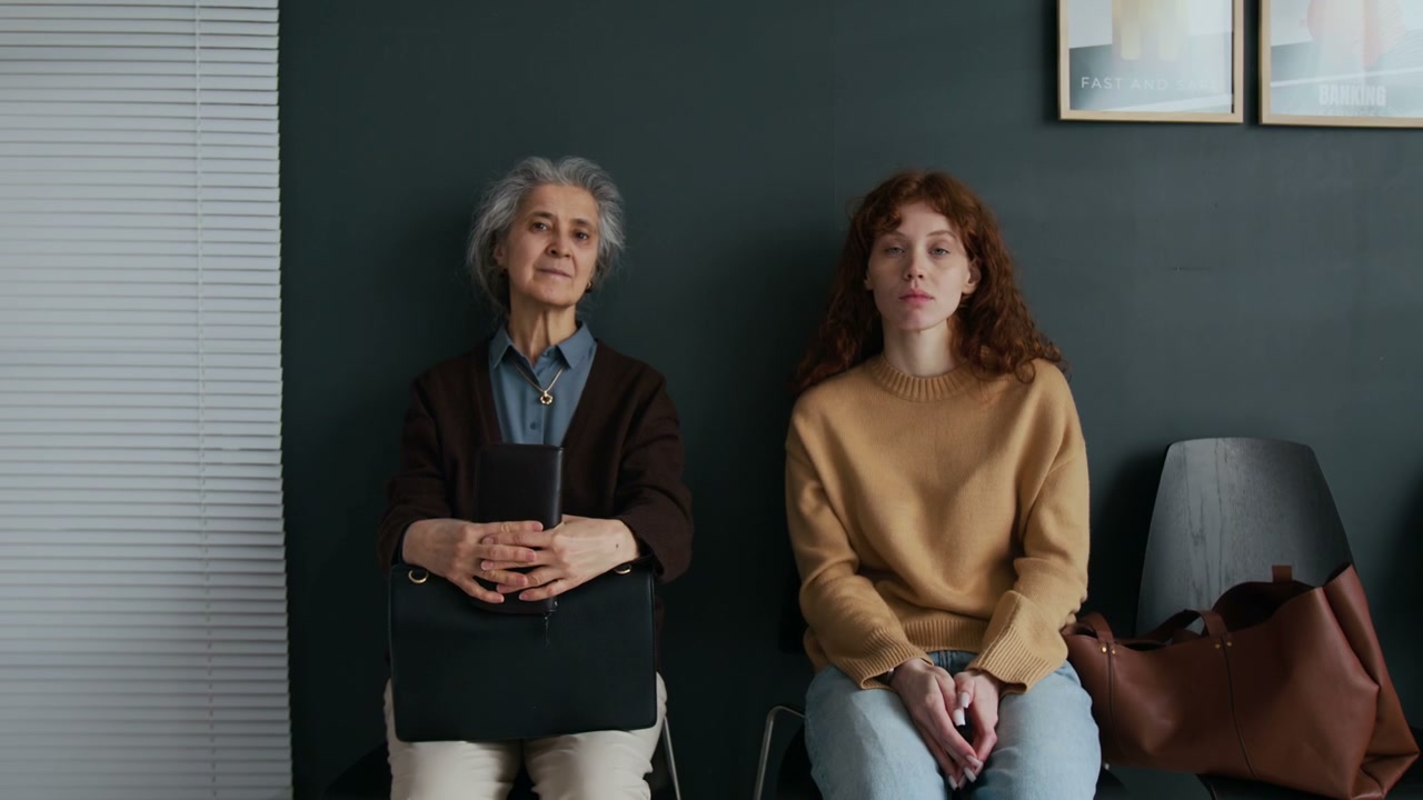 Two Women Waiting in a Lobby