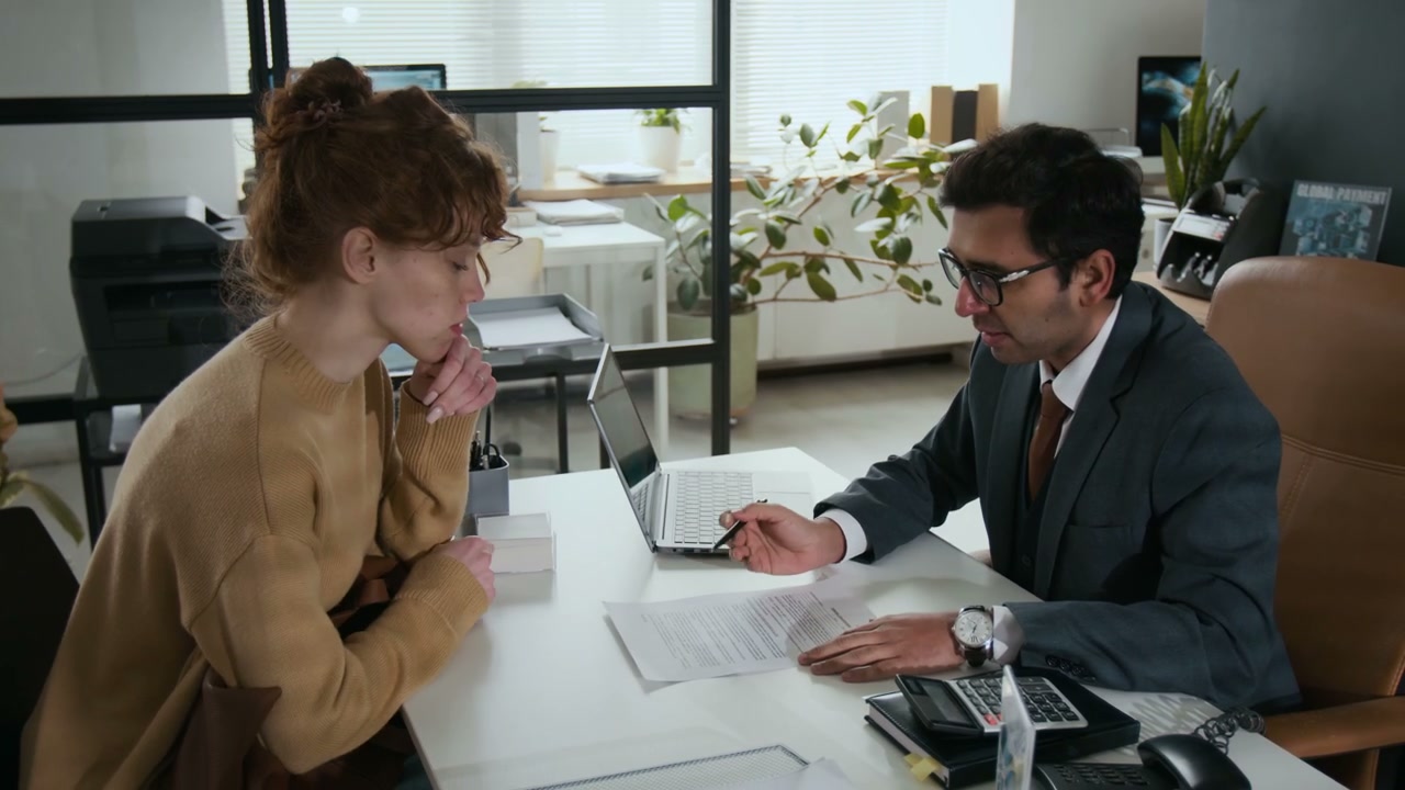 Financial Advisor and Client Discussing Documents