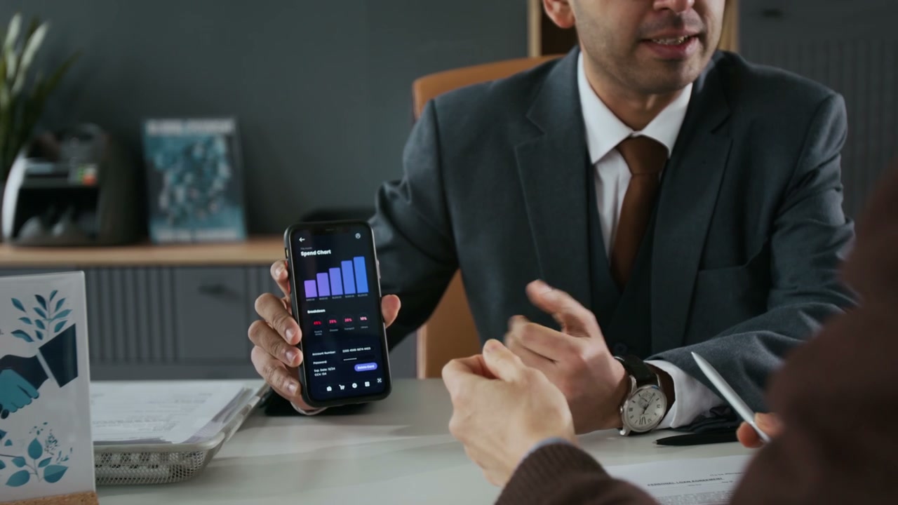 Business People Reviewing Financial Data on Phone