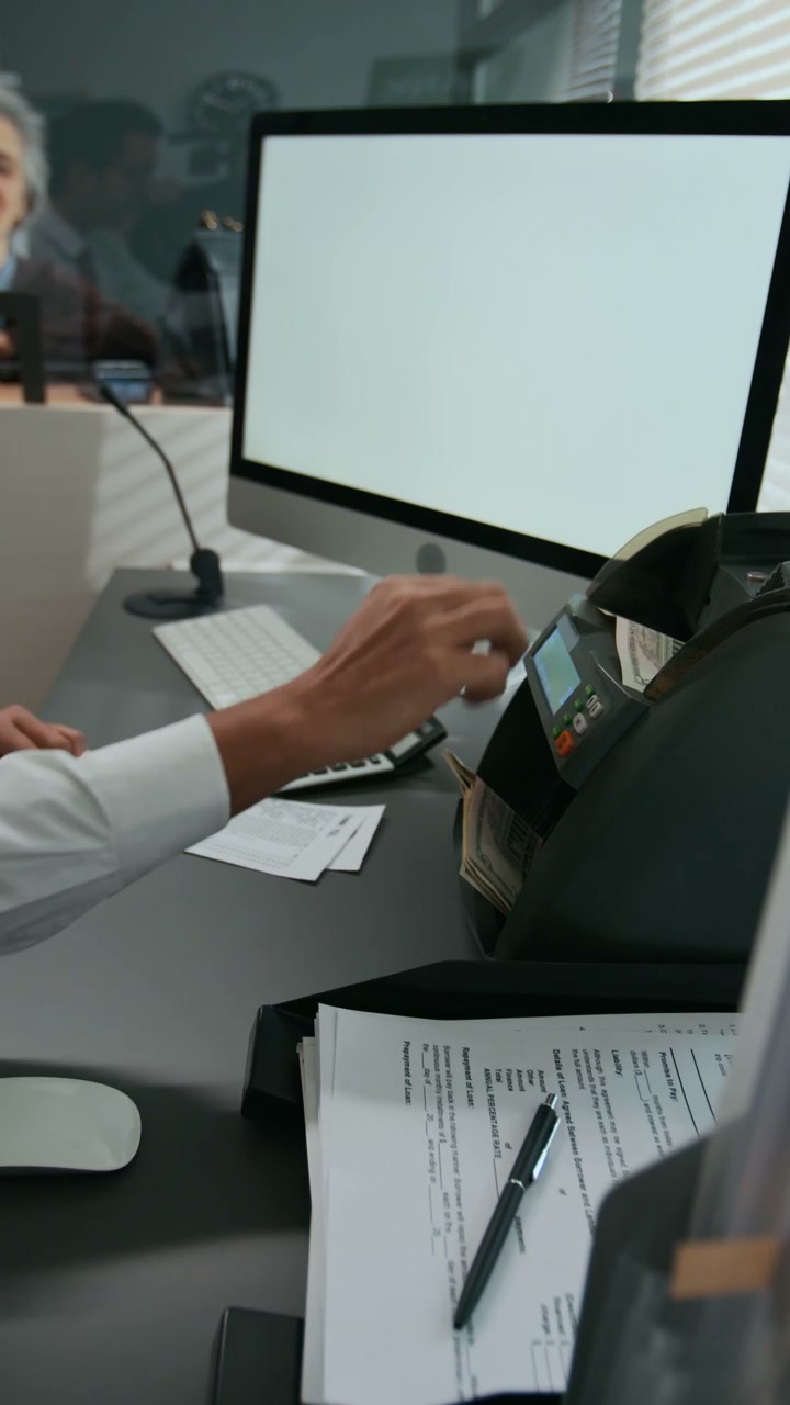 Person Counting Dollar Bills with Machine