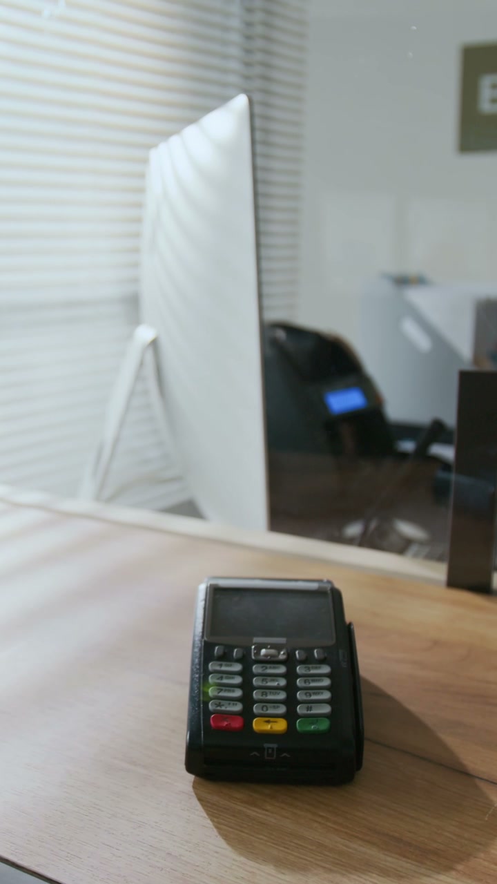 Modern Payment Terminal on Bank Counter