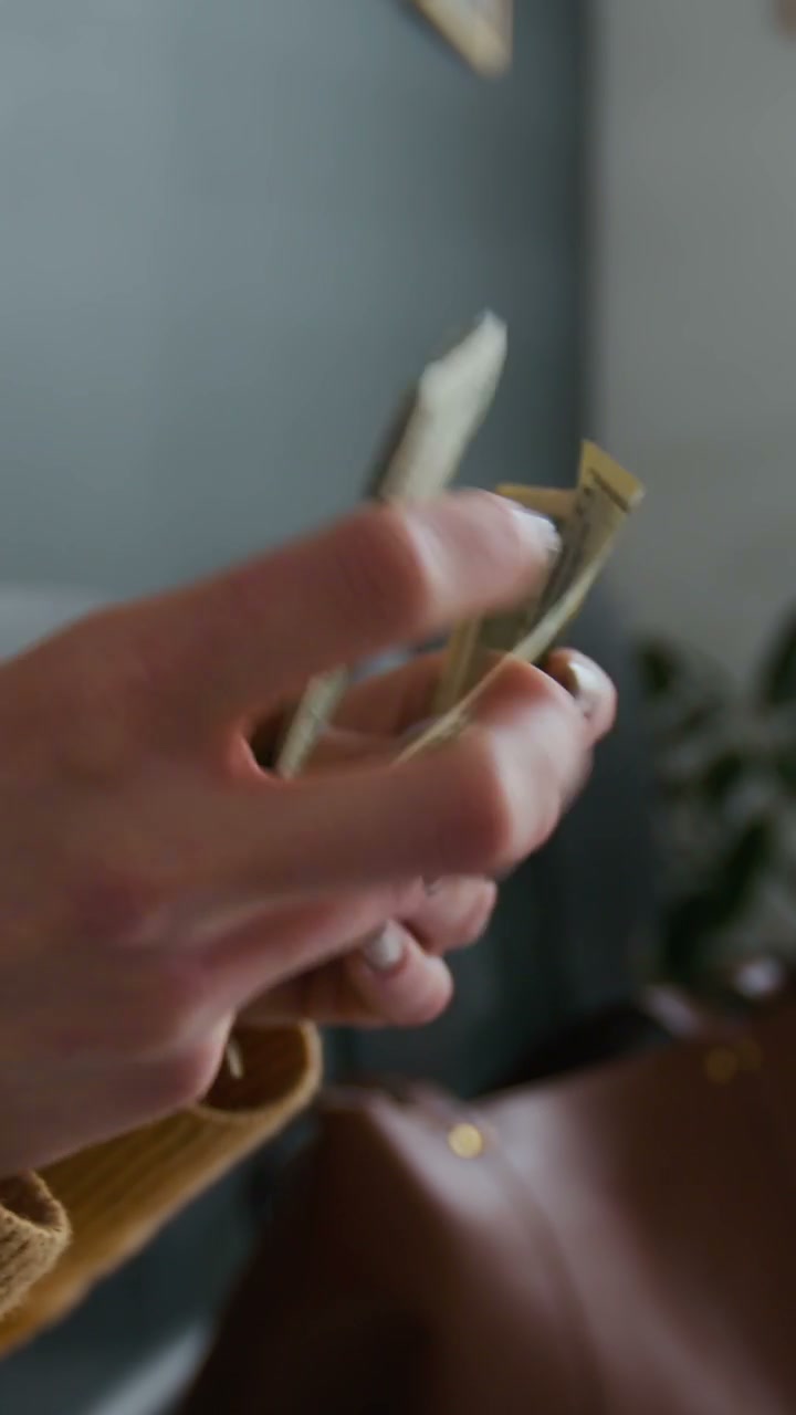 Close Up of Hands Counting US Dollar Bills