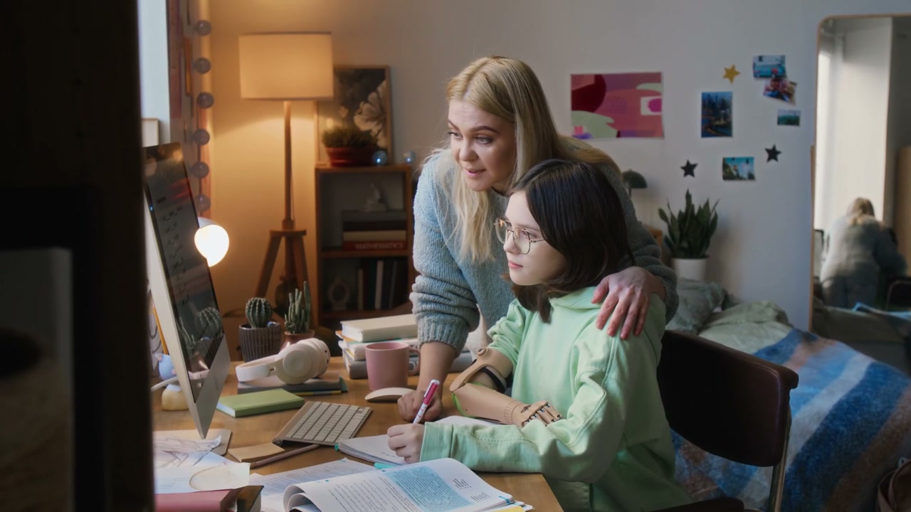 Mother Helps Daughter Study at Home
