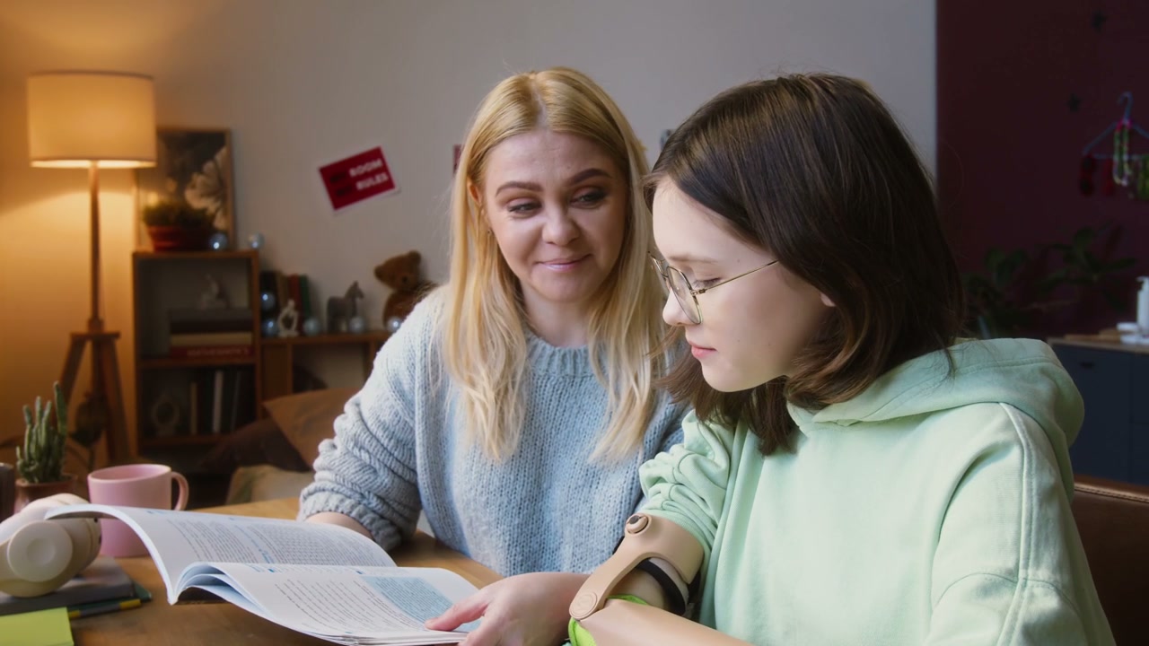 Mother Helps Daughter with Prosthetic Arm Study