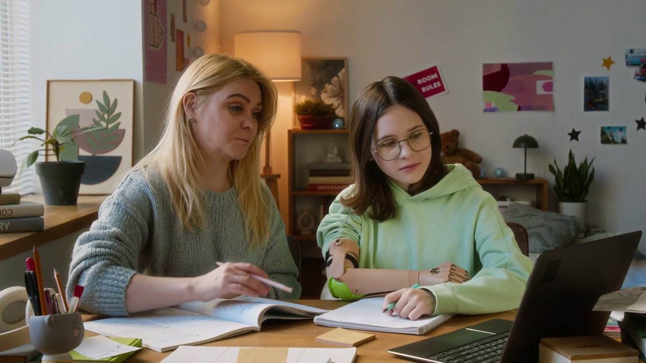 Mother Helping Daughter with Homework