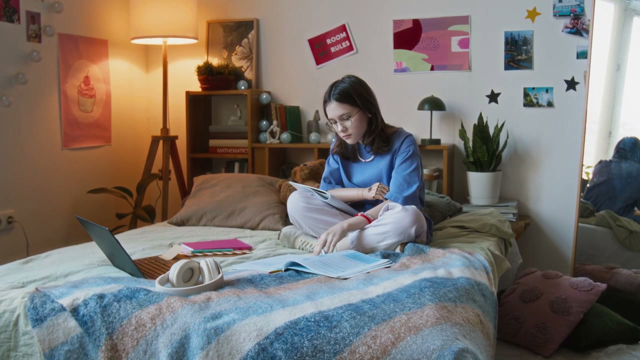 Teenage Girl with Prosthetic Arm Studying