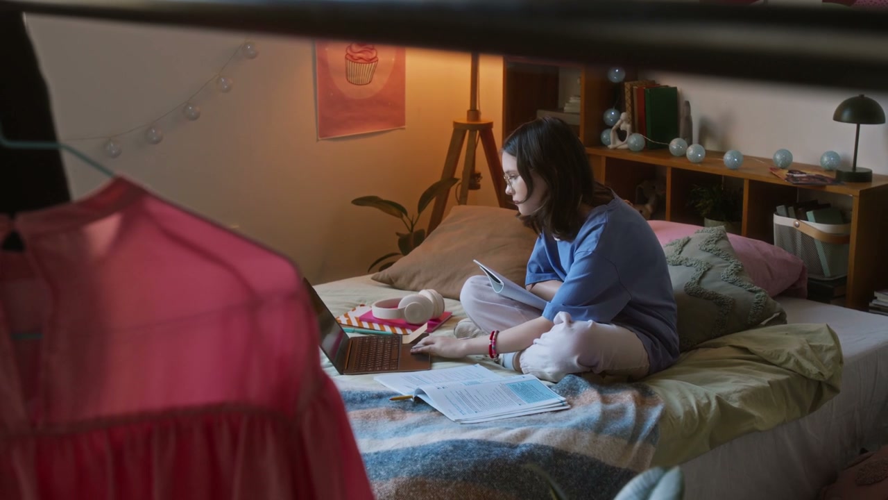 Teenage Girl Studies in Cozy Bedroom