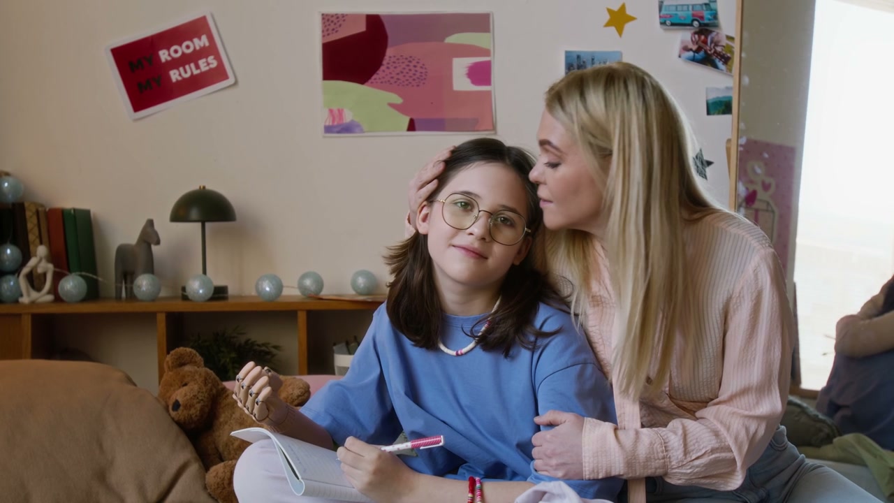 Mother and Daughter with Prosthetic Arm Smiling