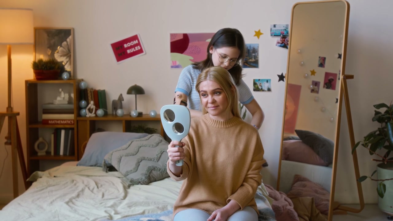 Mother Brushing Daughter's Hair with Prosthetic