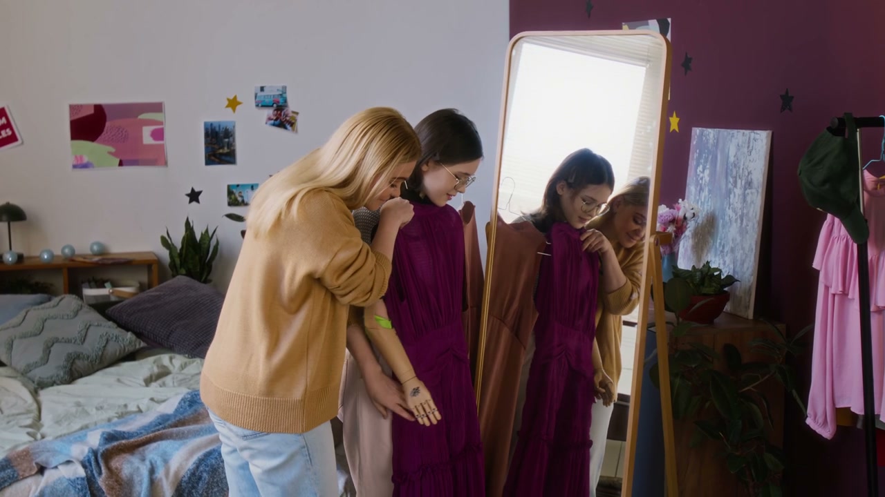 Mother And Daughter Choosing Outfits With Prosthetic Arm
