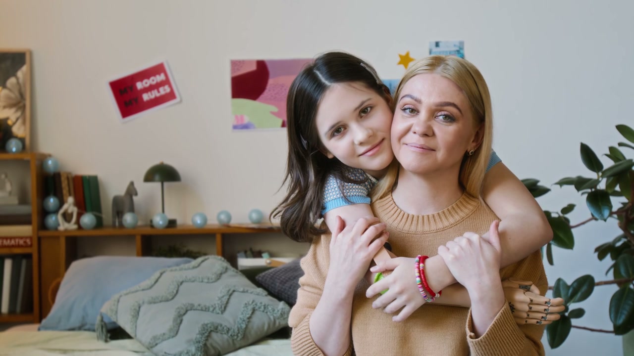 Girl Hugs Mother With Prosthetic Arm