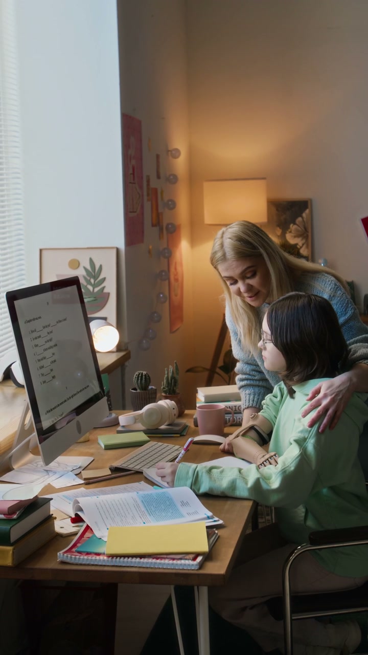Mother and Daughter Studying Homework at Desk