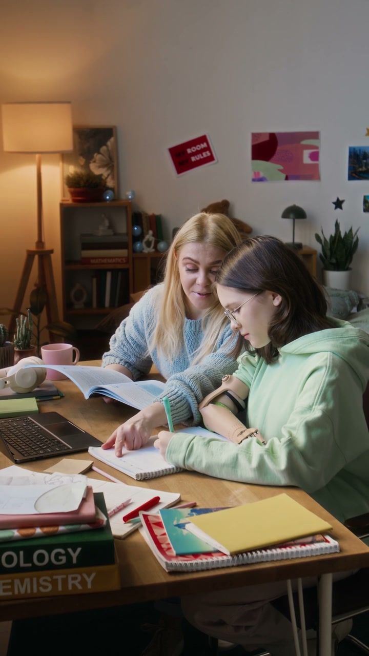 Mother and Daughter Studying with Prosthetic Arm