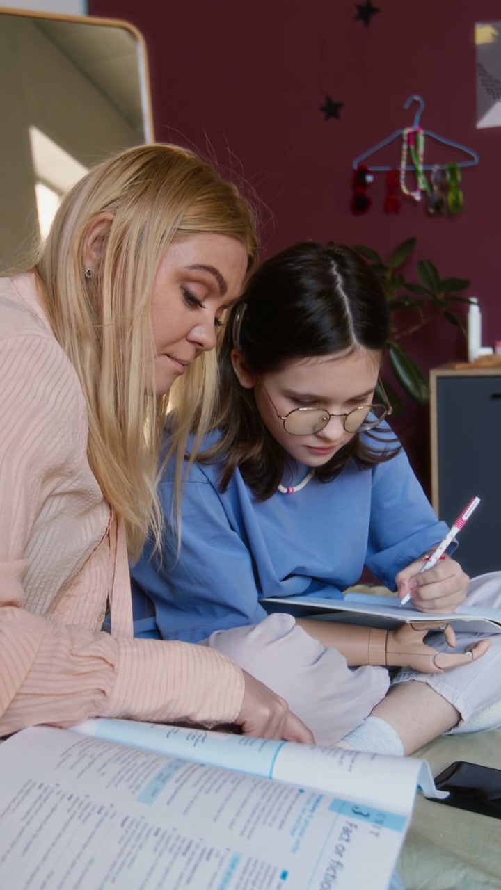 Mother Helping Daughter with Prosthetic Arm Study