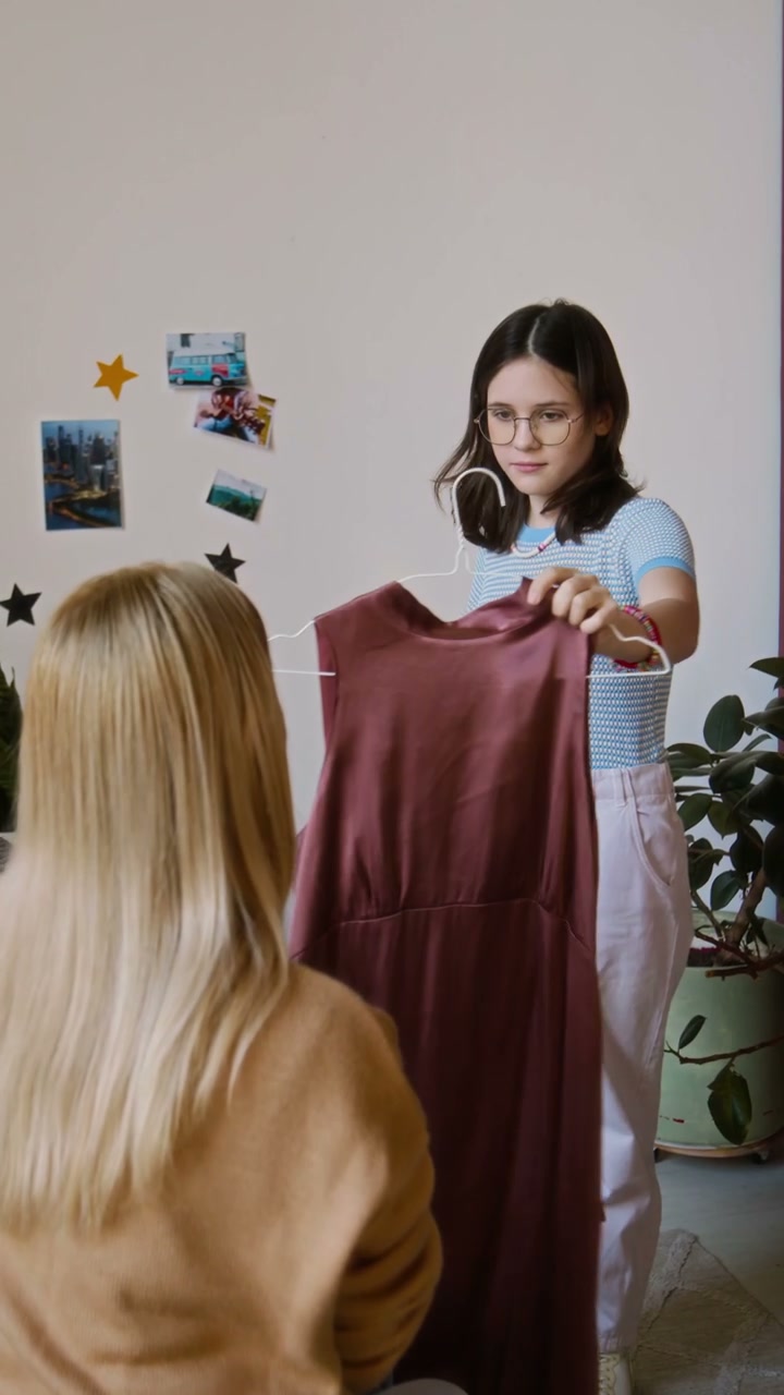 Mother and Daughter Choose Clothes with Prosthetic Arm