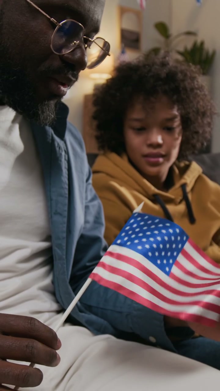 Father and Son Holding American Flag
