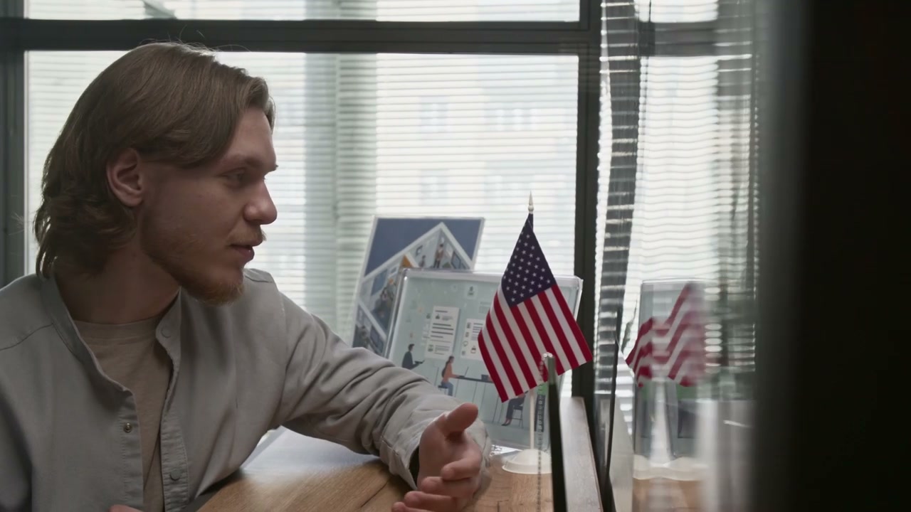 Man Interviewing Officer at Immigration Office