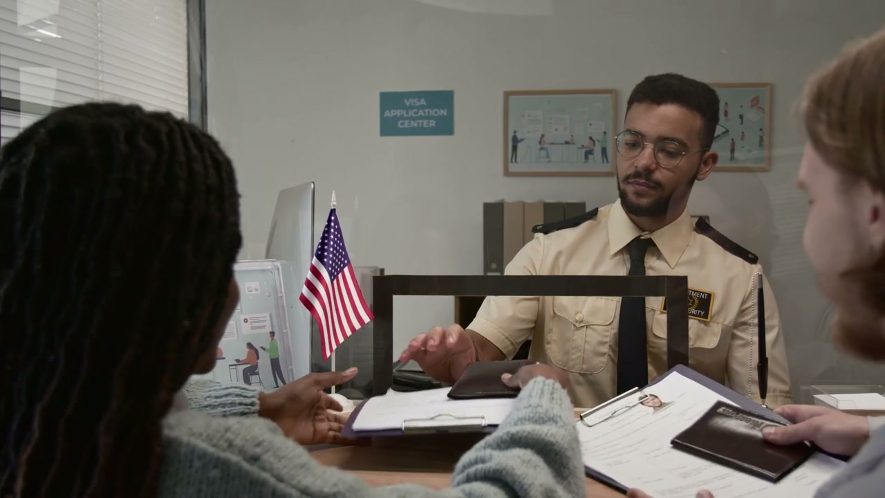 Diverse Couple Applying for Visa at US Center