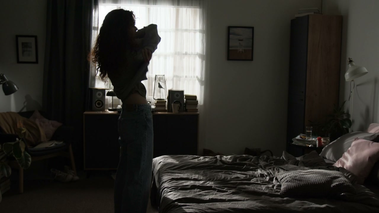Melancholy Woman Rests on Bed