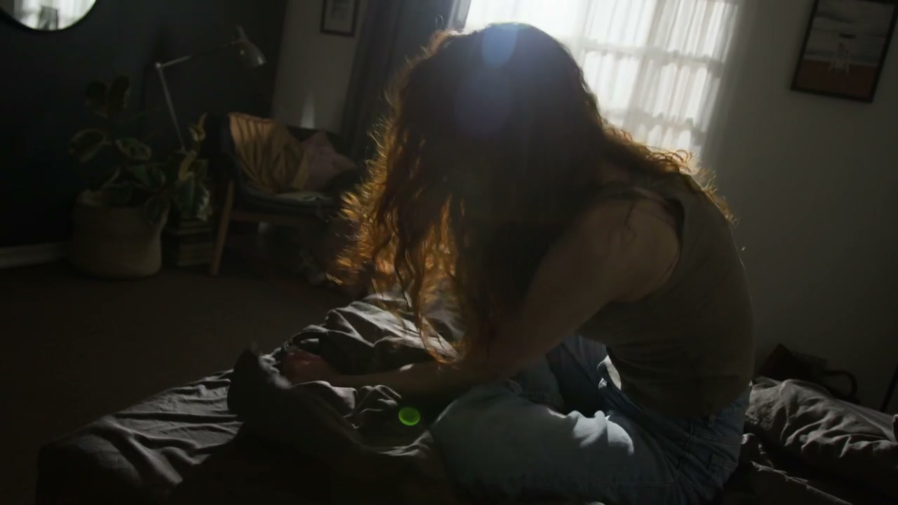 Anxious Woman Sitting on Bed