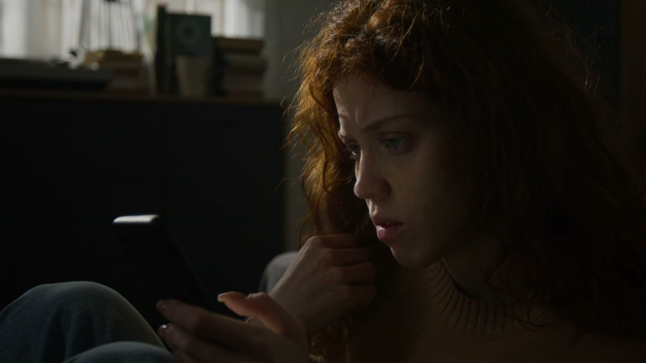 Woman Anxiously Using Smartphone